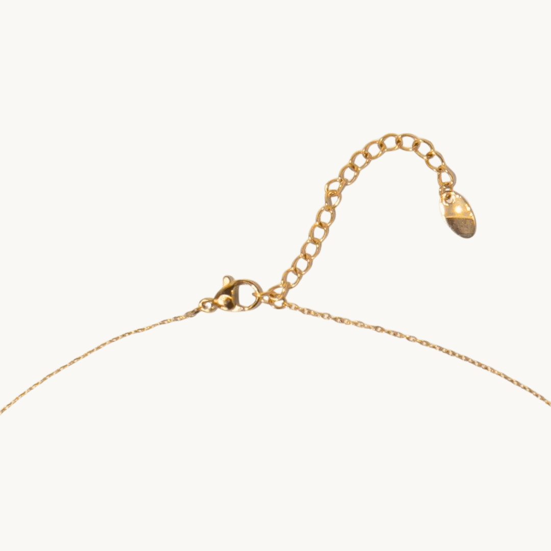 top view of round carnelian necklace layout – handcrafted detail on neutral