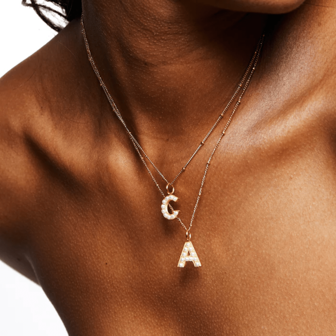 Layered gold necklaces featuring custom initials C and A – Moonela Jewelry